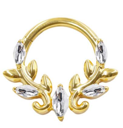 A gold zircon segment clicker ring in nickel free implant grade titanium